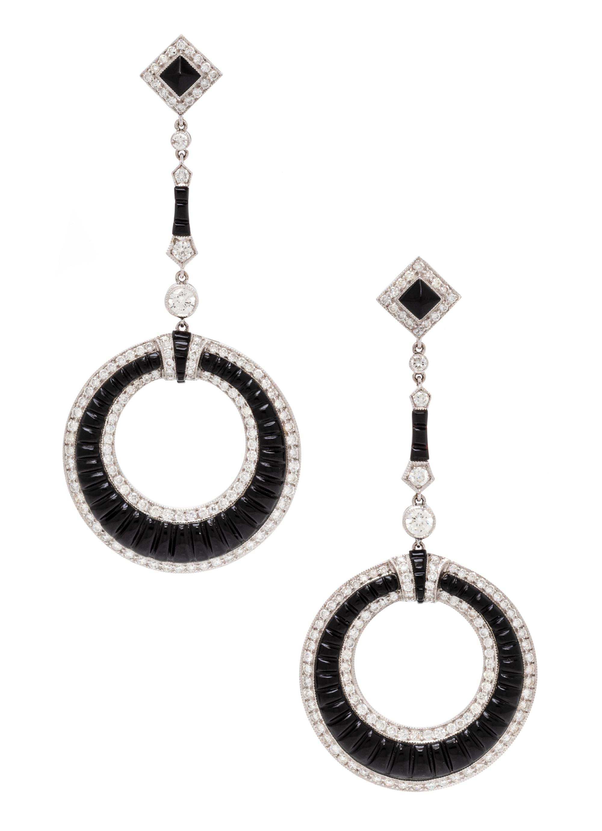 A Pair of 18 Karat White Gold, Diamond and Onyx Earrings, 10.00 dwts.