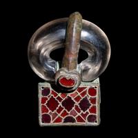 A Merovingian Bronze, Rock Crystal, and Garnet Belt Buckle
