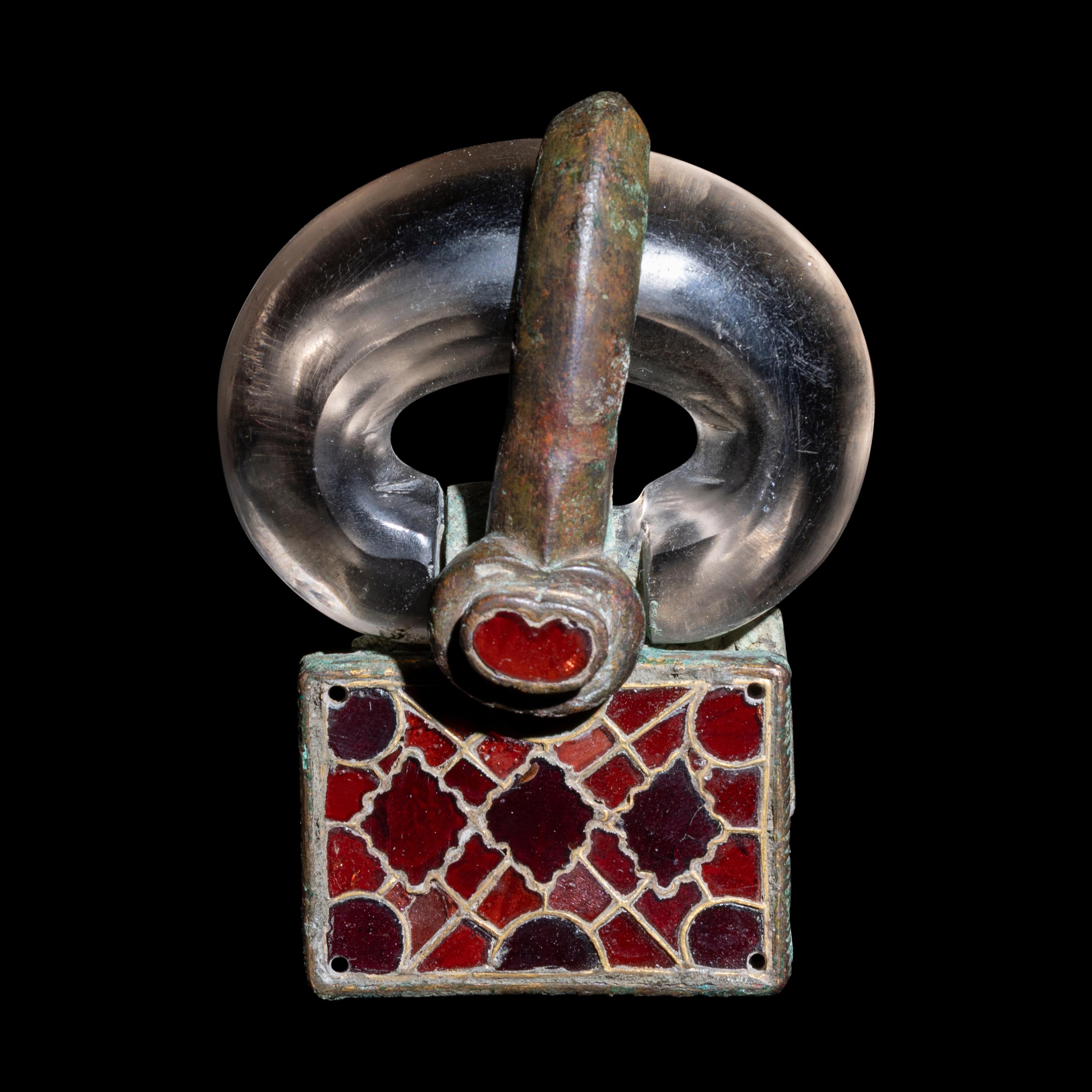 A Merovingian Bronze, Rock Crystal, and Garnet Belt Buckle