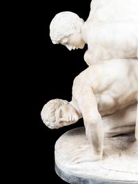 A Carved Alabaster Figural Group of The Wrestlers After the Antique
