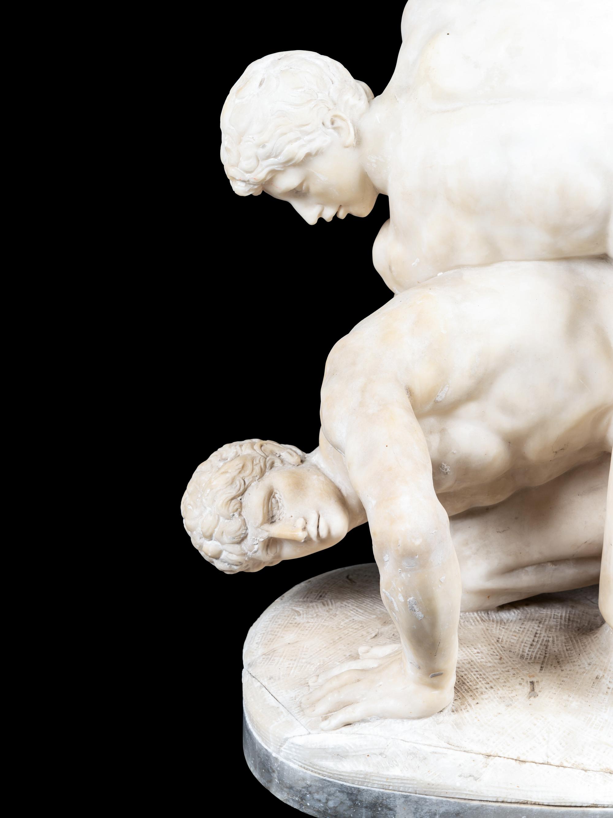 A Carved Alabaster Figural Group of The Wrestlers After the Antique