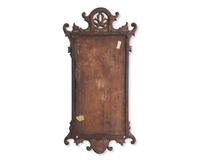 A Chippendale Fret-Carved and Parcel-Gilt and Inlaid Mahogany Mirror