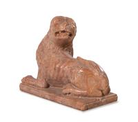 A Continental Carved Figure of a Recumbent Lion