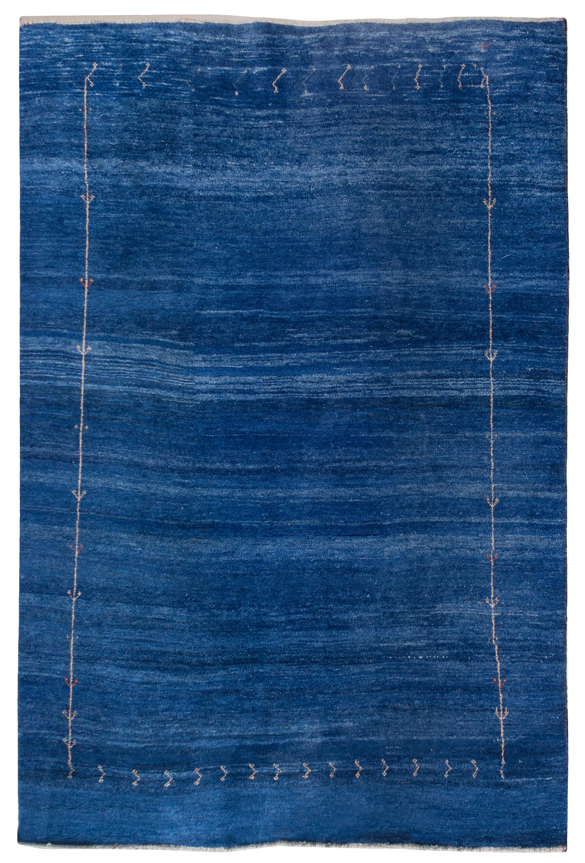 A Tibetan Wool Rug 8 feet 3 inches x 6 feet 2 inches. — SECOND HALF 20TH CENTURY