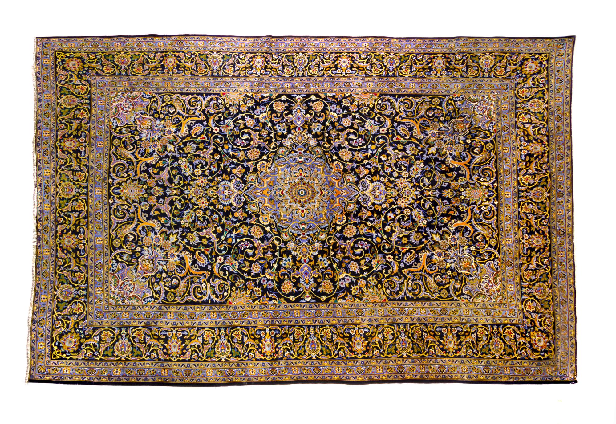 A Kashan Wool Rug 14 feet 1 inch x 9 feet 8 inches.