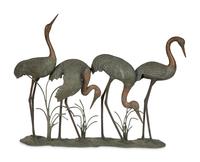 A Bronze Sculpture of Four Standing Cranes