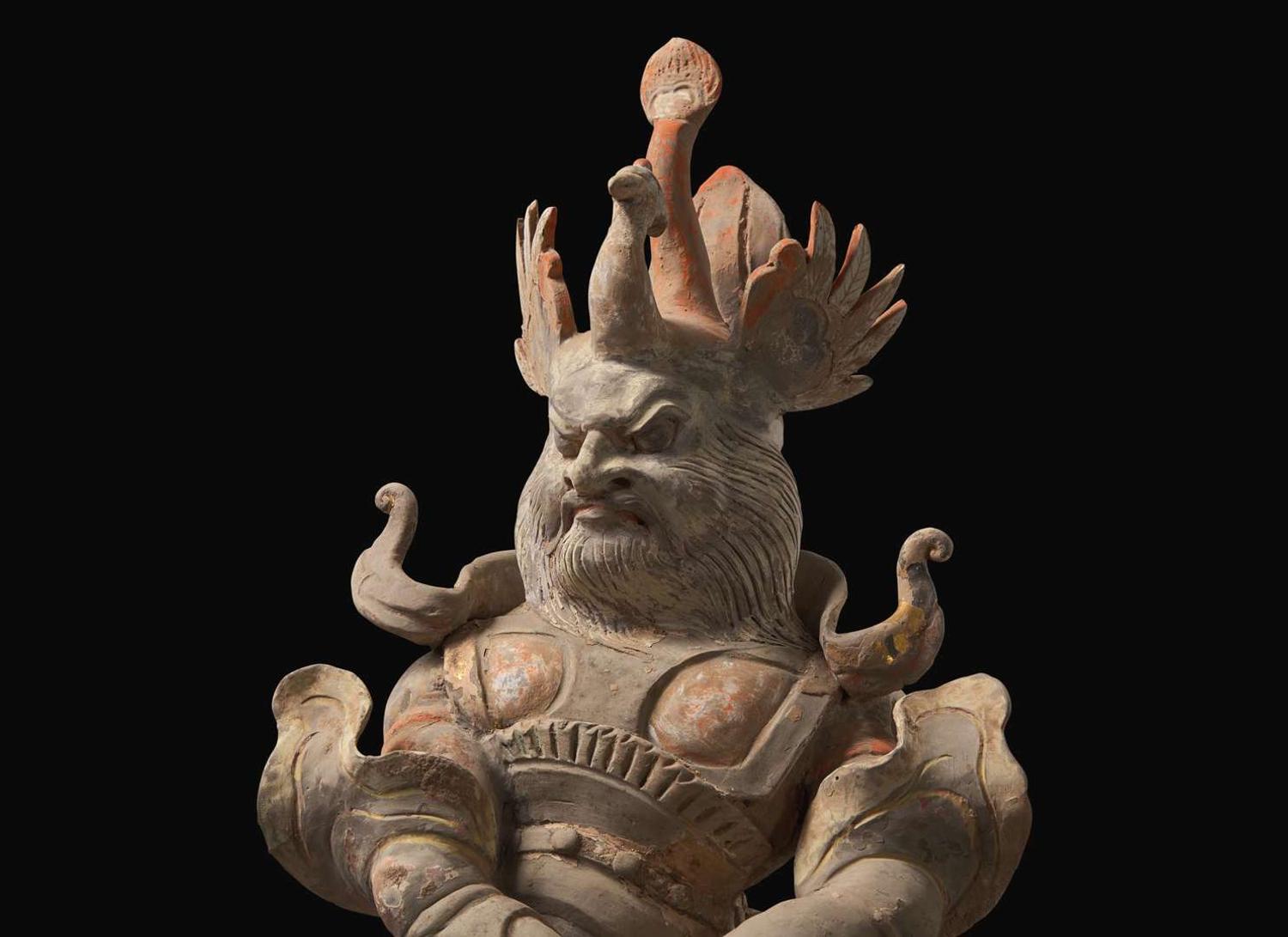 A Chinese painted and parcel-gilt pottery guardian, Tang dynasty 彩繪漆金陶俑天王 唐