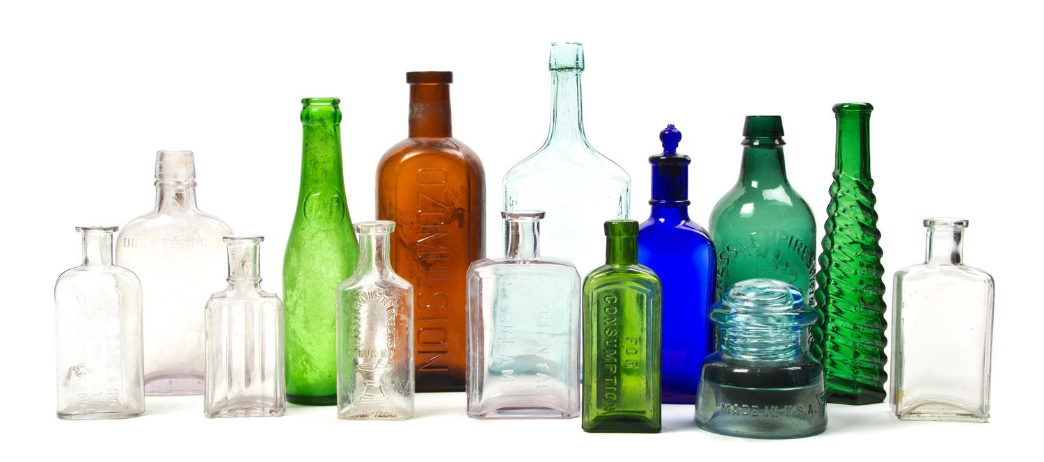 A Collection of American Glass Bottles, Height of tallest 9 1/2 inches.