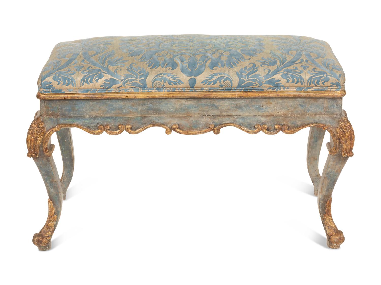 An Italian Painted and Parcel Gilt Bench with Fortuny Upholstery