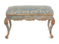 An Italian Painted and Parcel Gilt Bench with Fortuny Upholstery