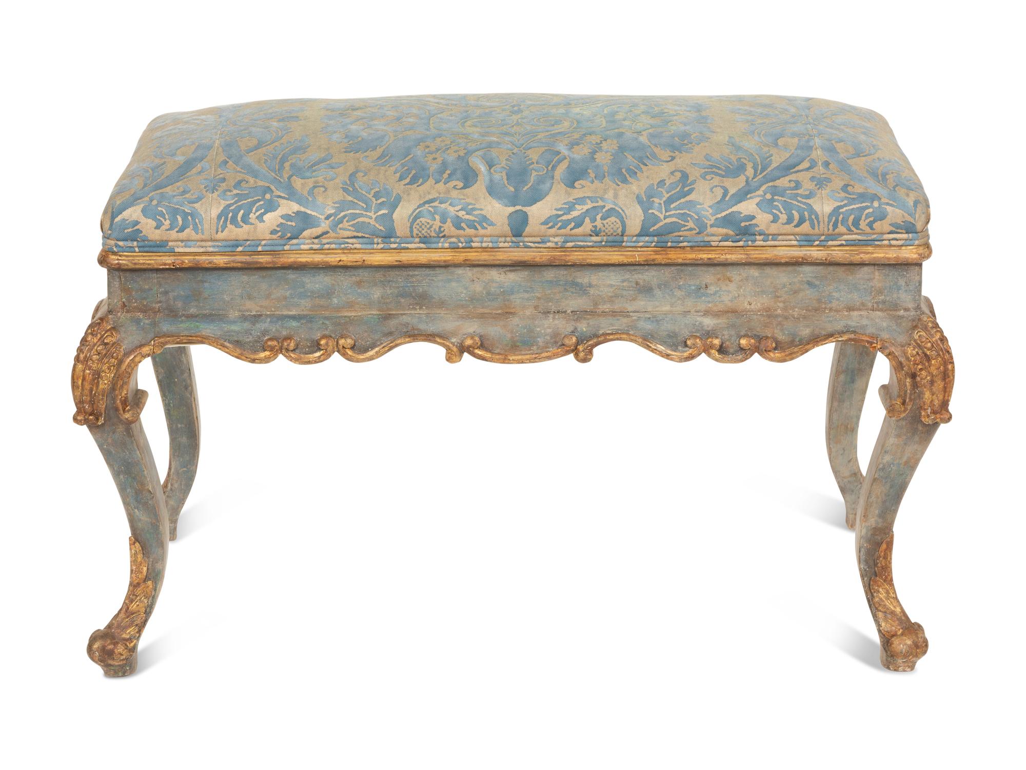 An Italian Painted and Parcel Gilt Bench with Fortuny Upholstery