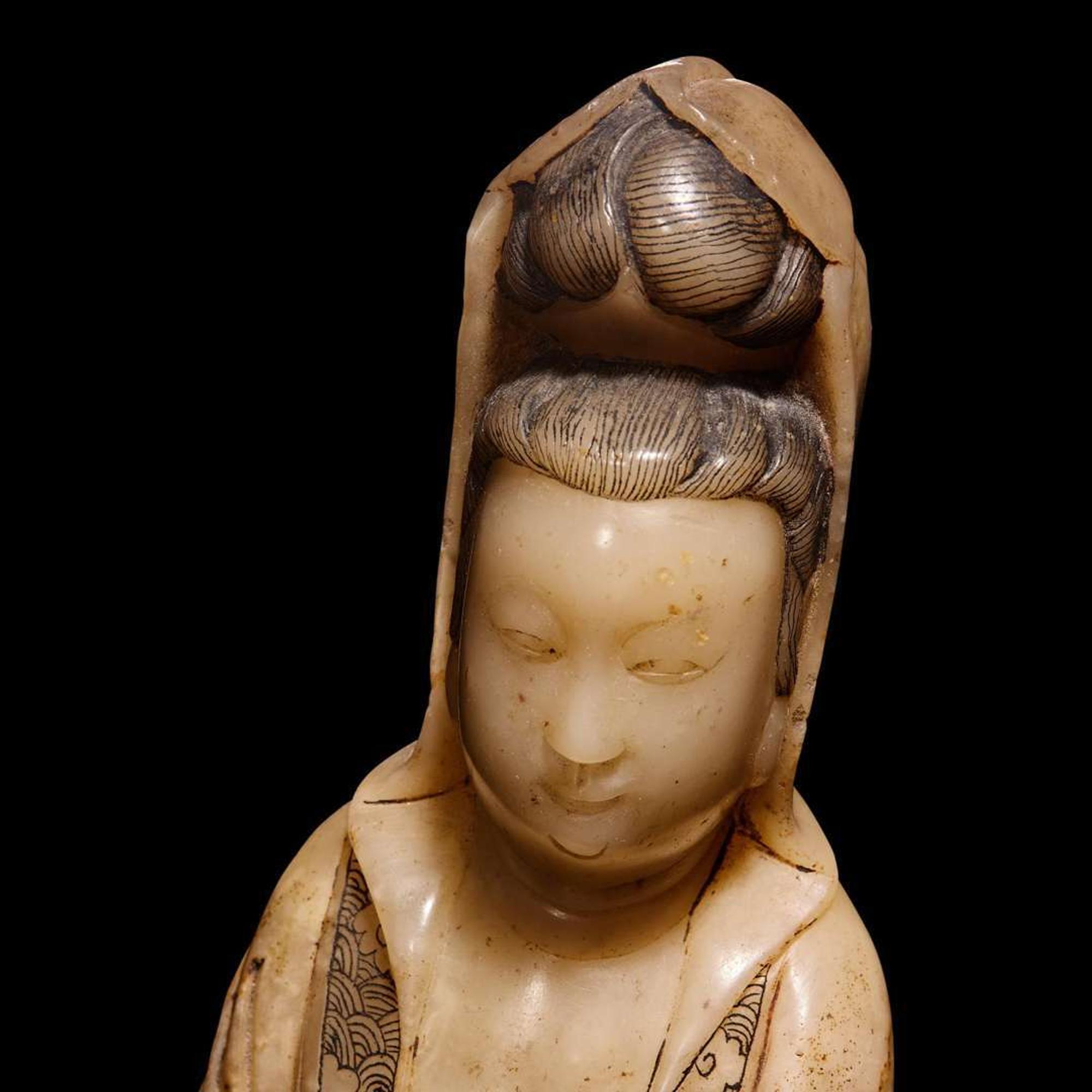 A Chinese carved beige soapstone figure of Guanyin and carved hardwood stand 壽山石雕觀音配木座 Late Qing dynasty/Republic period ?????