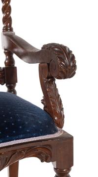 A Set of Ten Jacobean Style Carved Walnut Dining Chairs