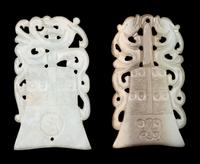 Two Celadon Jade Bell-Form Pendants