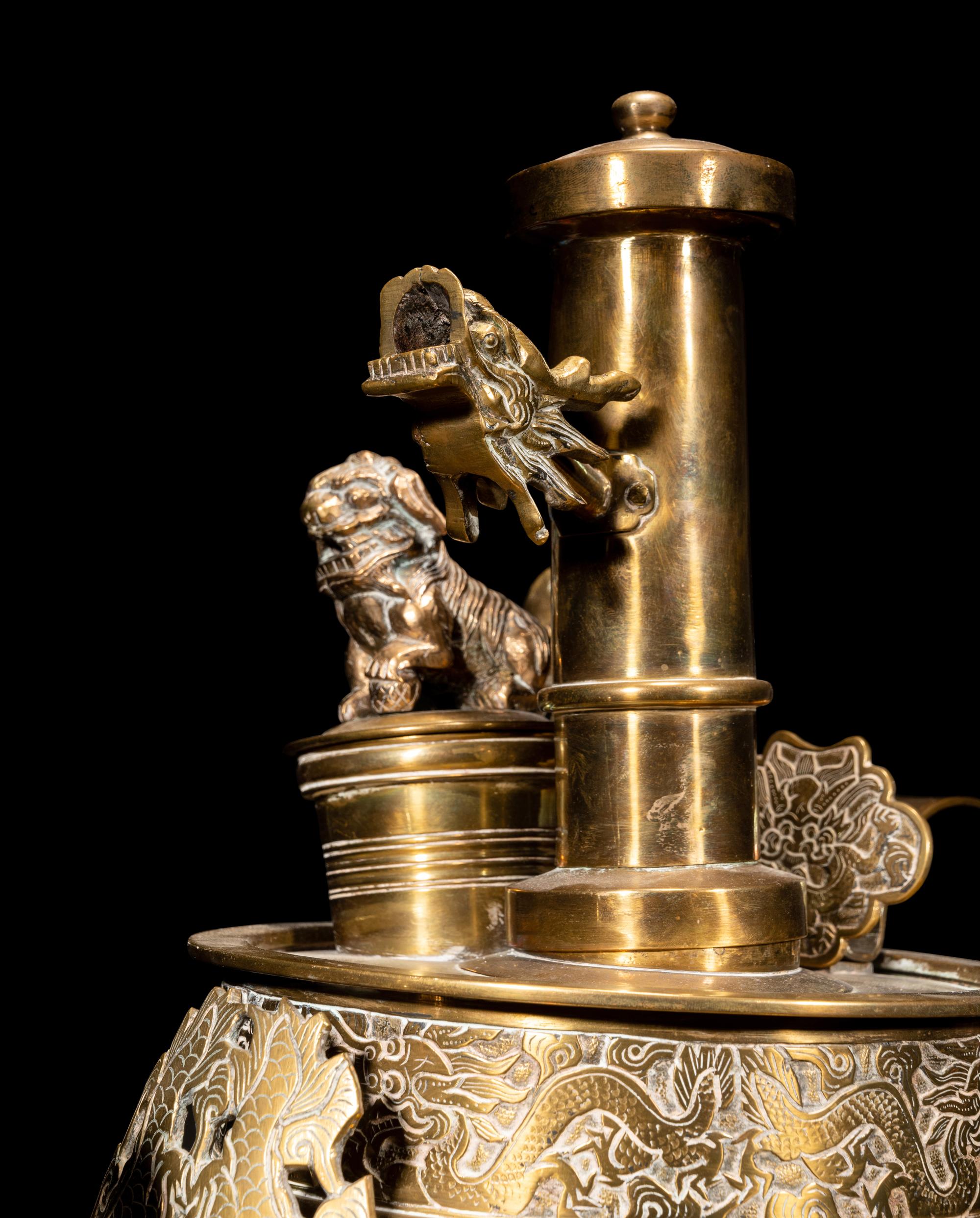 A Tibetan Silver and Copper Covered Ewer and A Chinese Bronze Pitcher