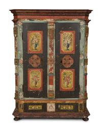 A Continental Carved, Painted and Parcel Gilt Pine Schrank