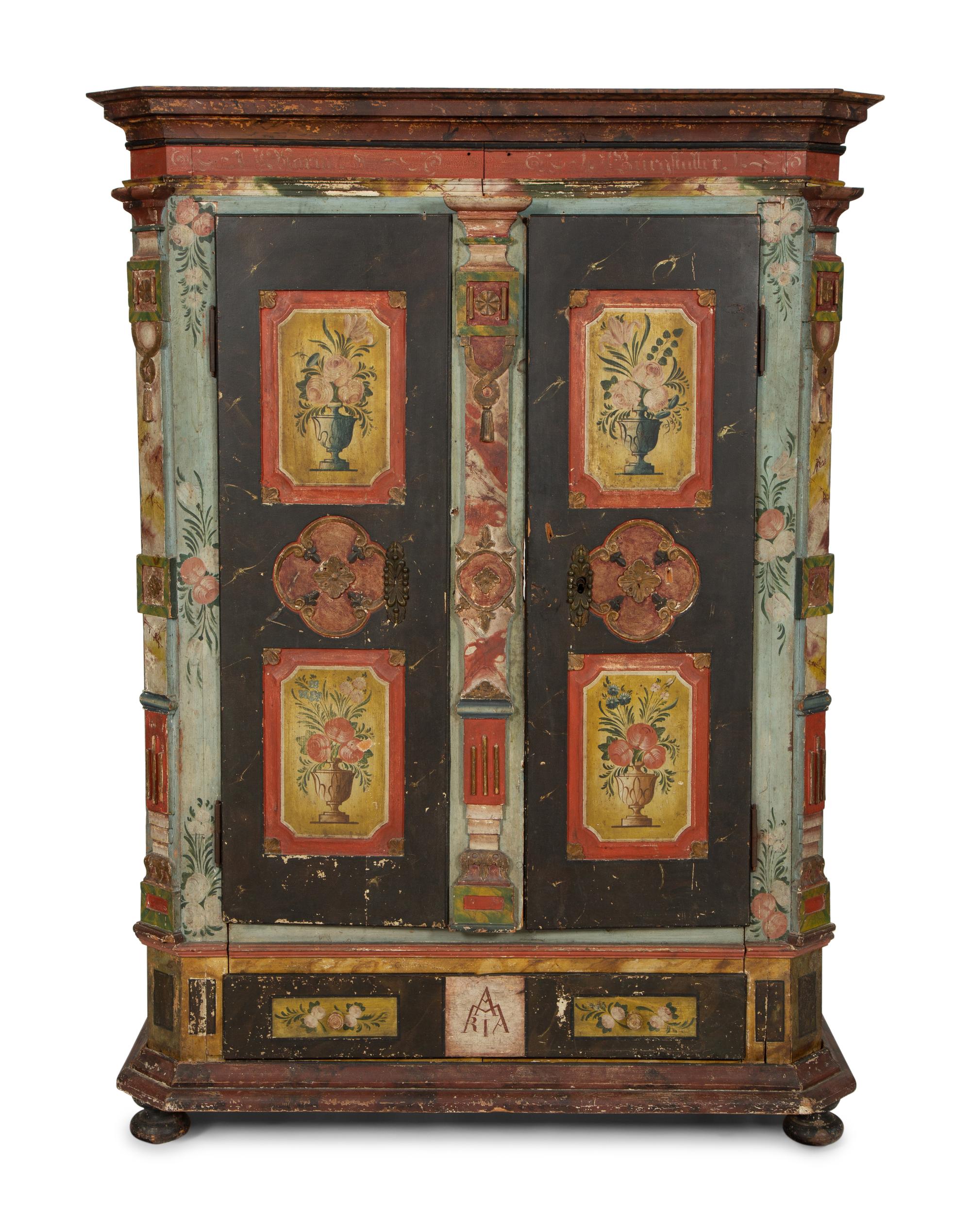 A Continental Carved, Painted and Parcel Gilt Pine Schrank