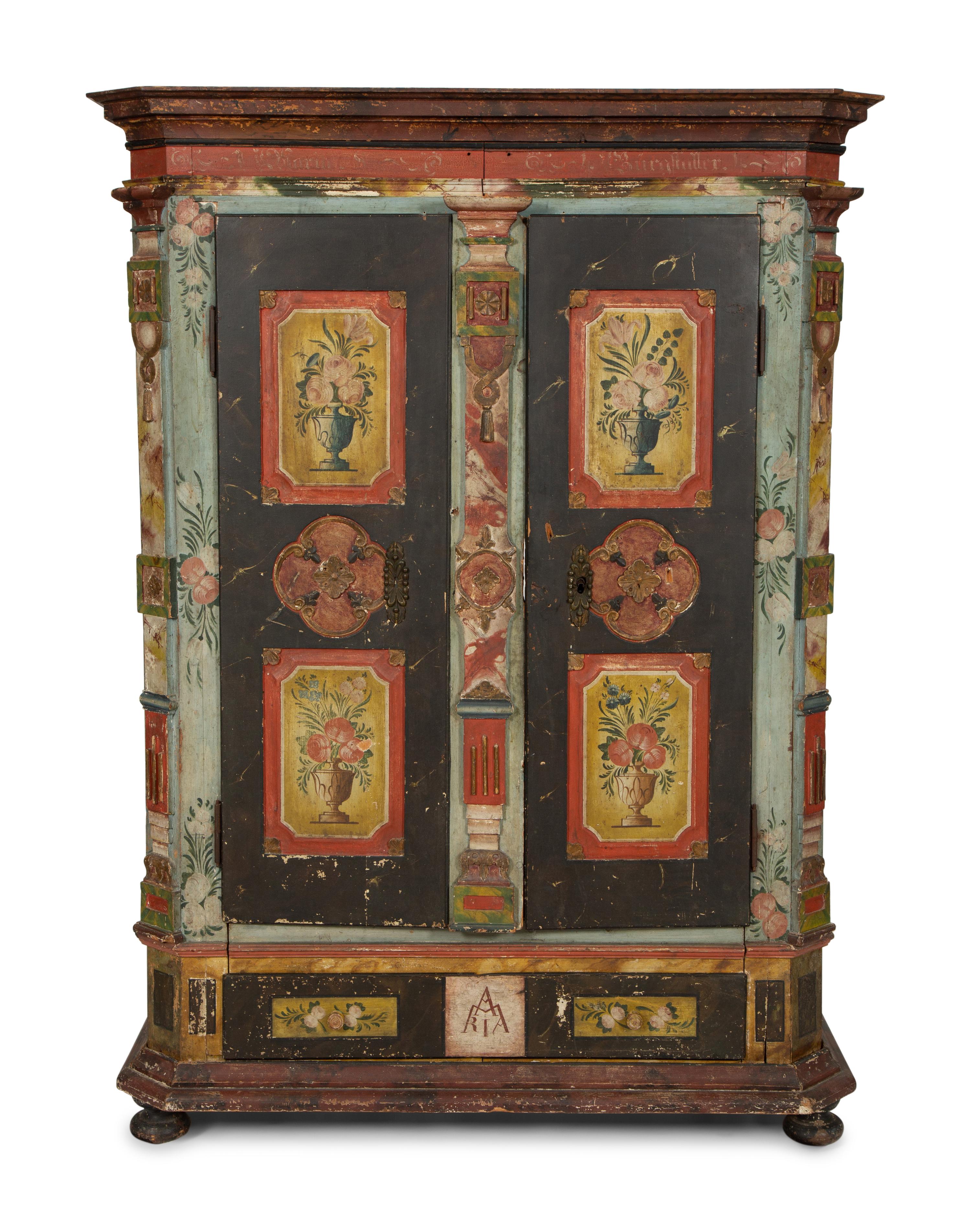 A Continental Carved, Painted and Parcel Gilt Pine Schrank