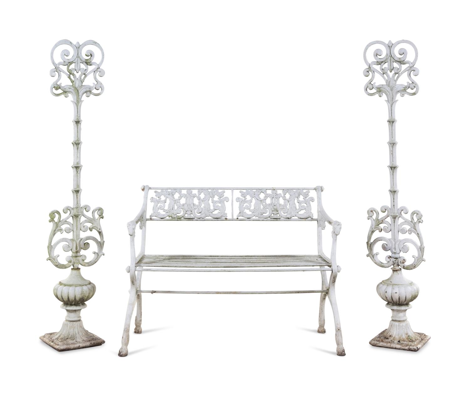 A White Painted Iron Garden Bench and a Pair of Torchères