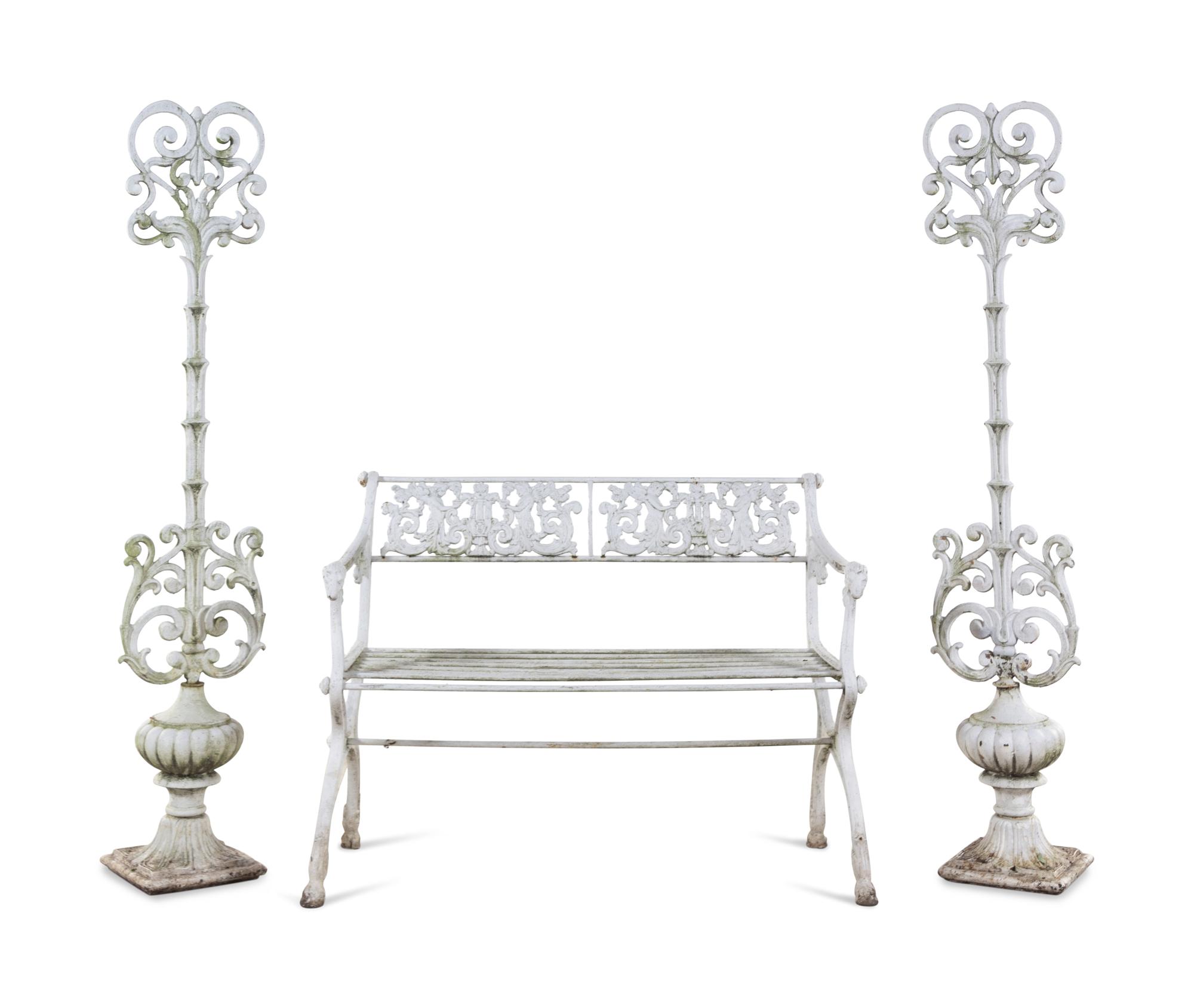 A White Painted Iron Garden Bench and a Pair of Torchères