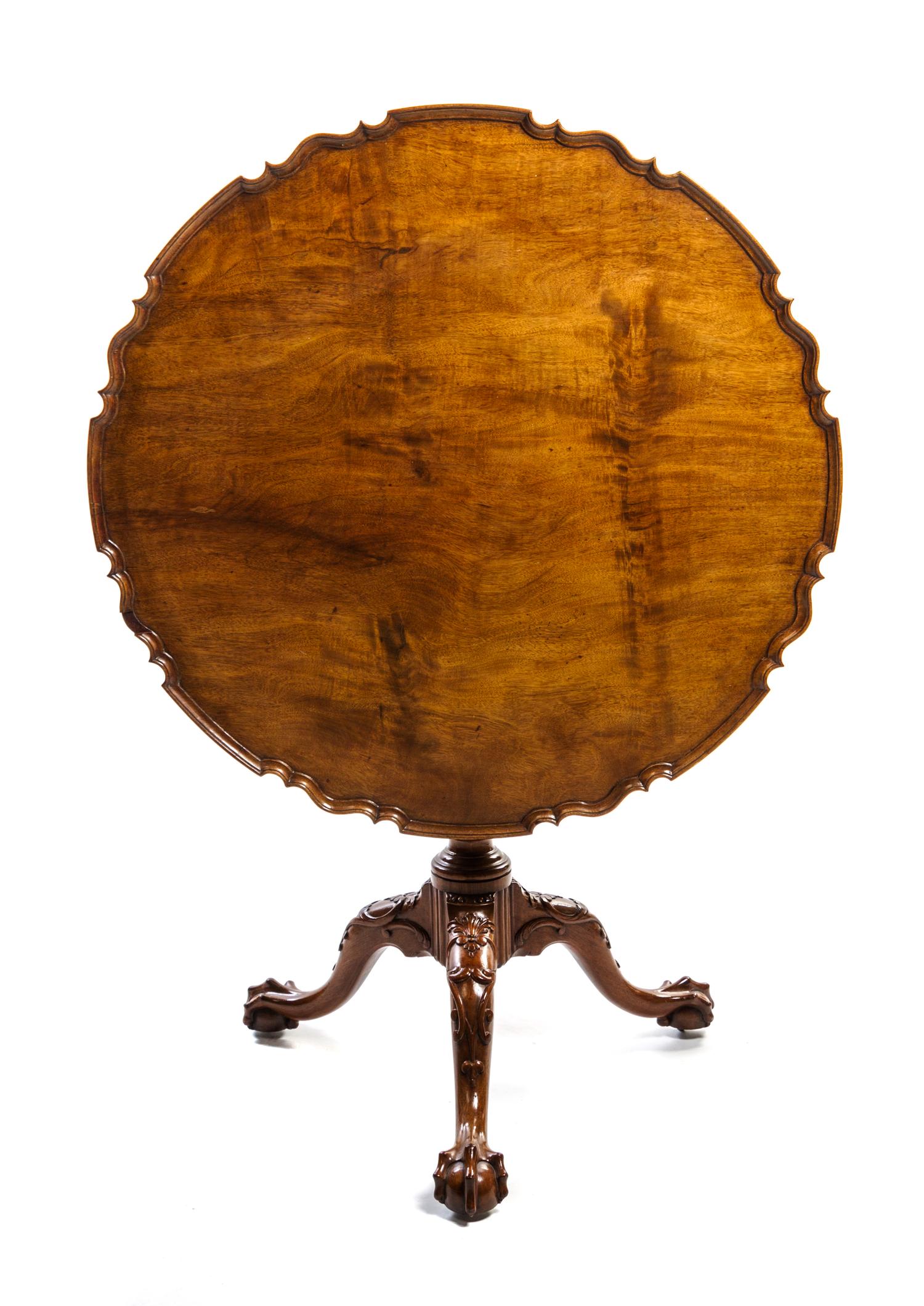 A George III Mahogany Tilt-Top Tea Table Height 29 1/4 x diameter 34 1/4 inches. — EARLY 19TH CENTURY
