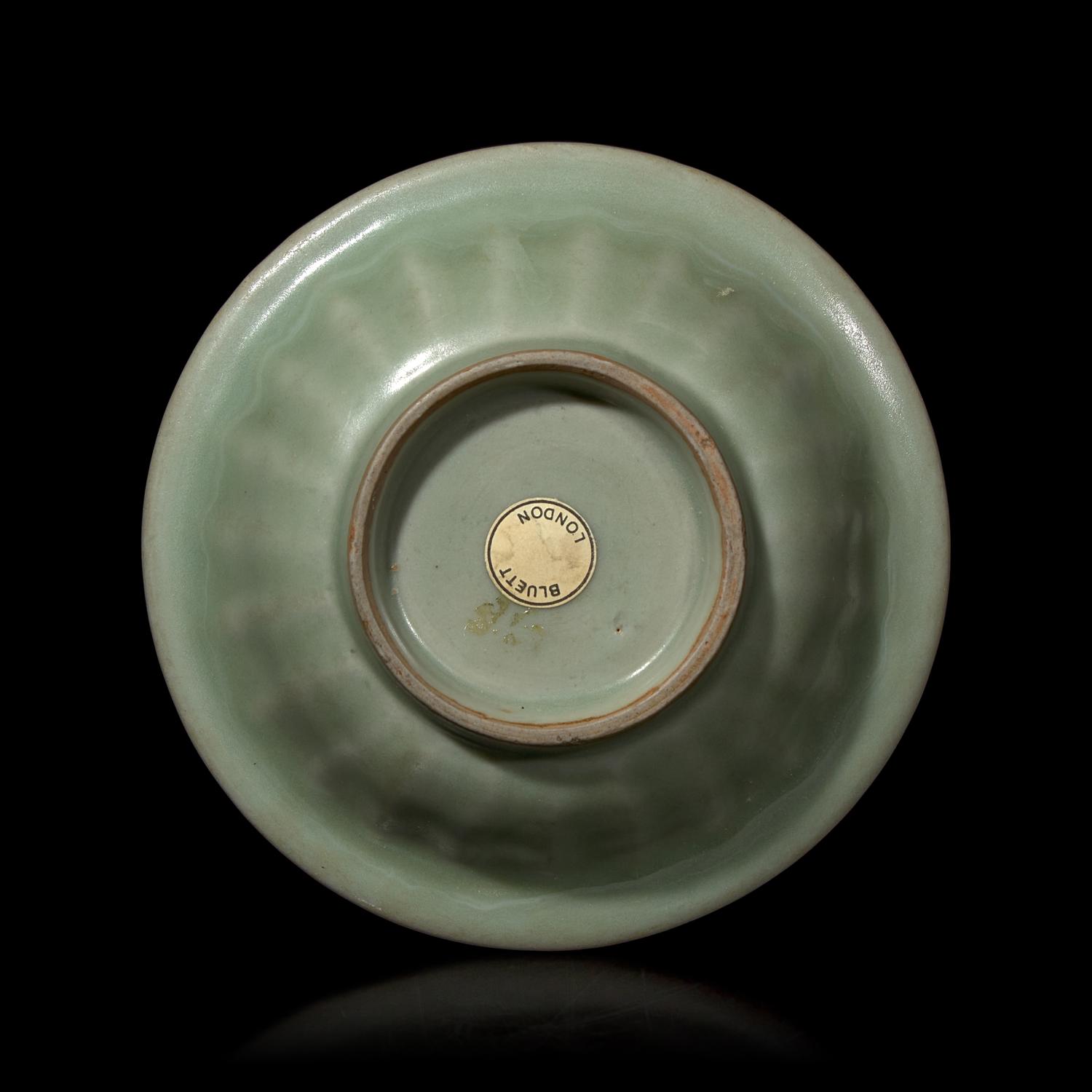 A Chinese Longquan Celadon Glazed 'Double Fish' Dish, Song-Yuan Dynasty 宋-元 龍泉窯雙魚碟
