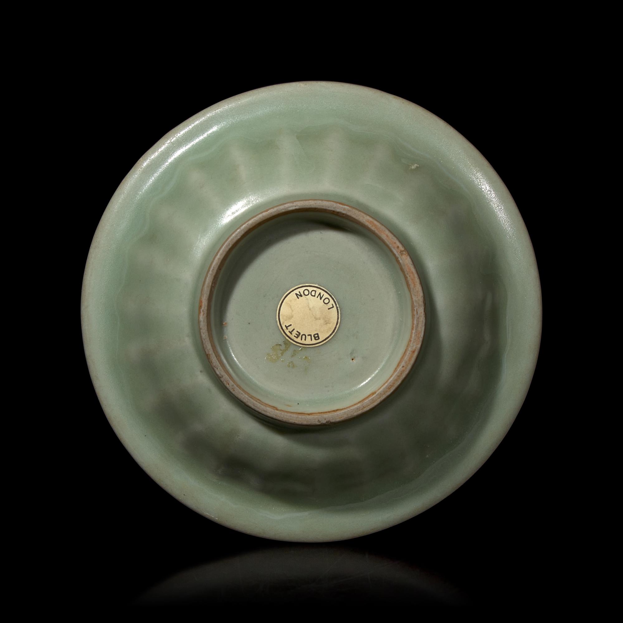 A Chinese Longquan Celadon Glazed 'Double Fish' Dish, Song-Yuan Dynasty 宋-元 龍泉窯雙魚碟