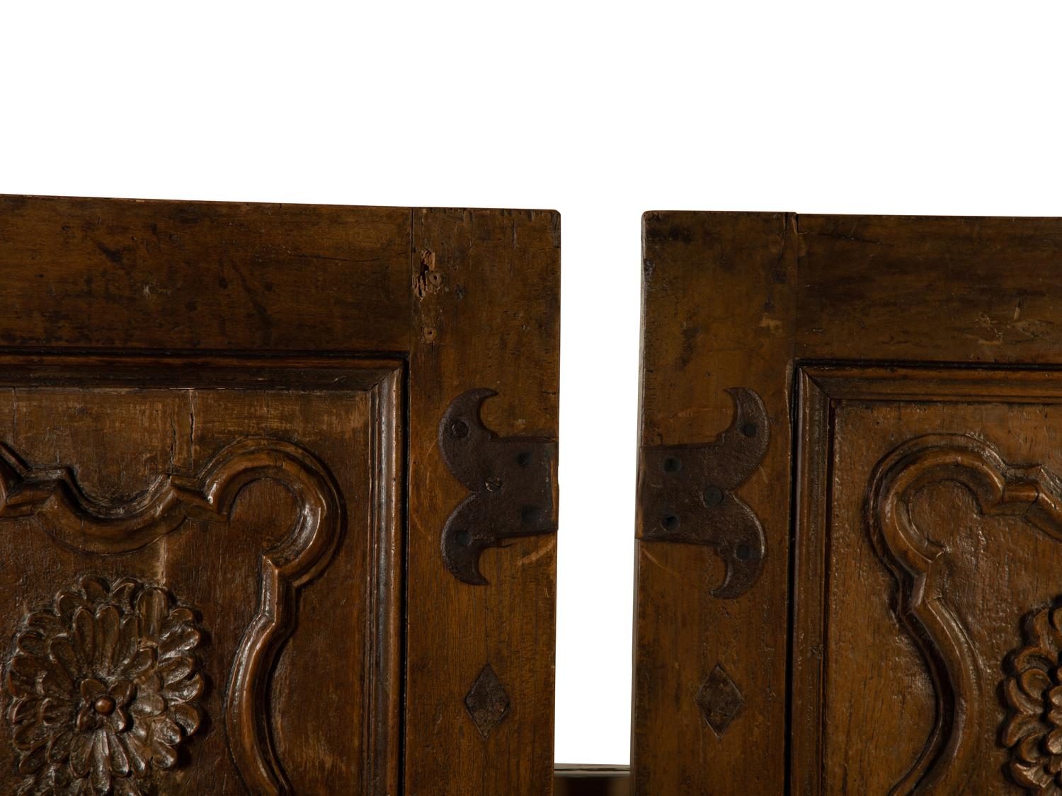 A Pair of Italian Carved Walnut Wall Panels