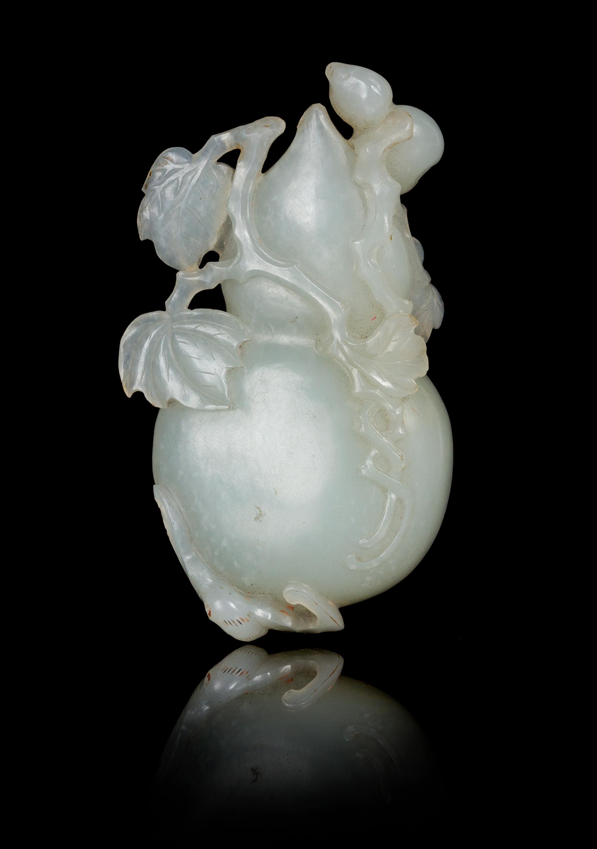 A Carved Pale Celadon Jade Toggle of a Gourd Length 3 3/4 inches. — LATE QING DYNASTY