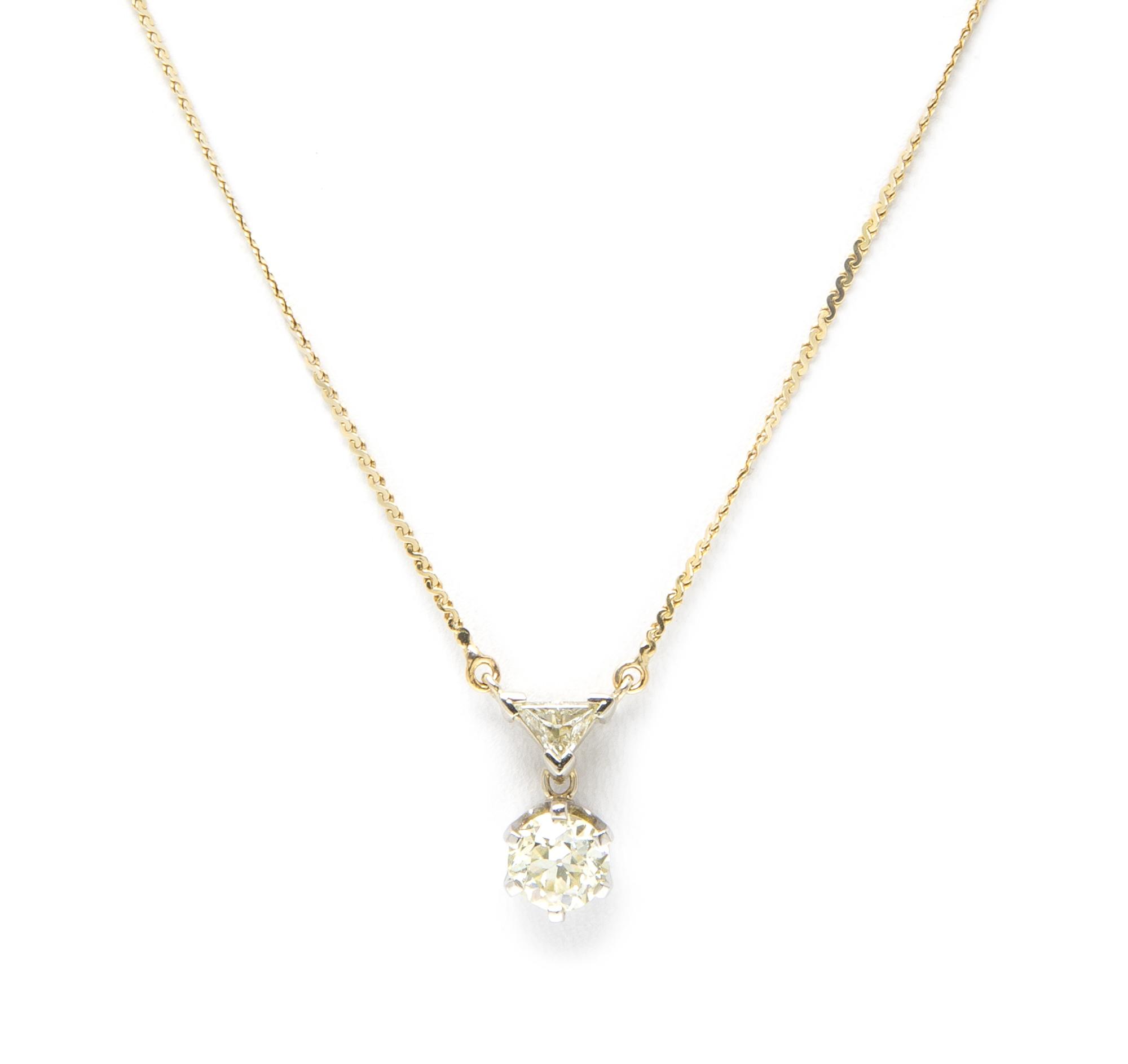 A 14 Karat Yellow and Diamond Pendant, 2.40 dwts.