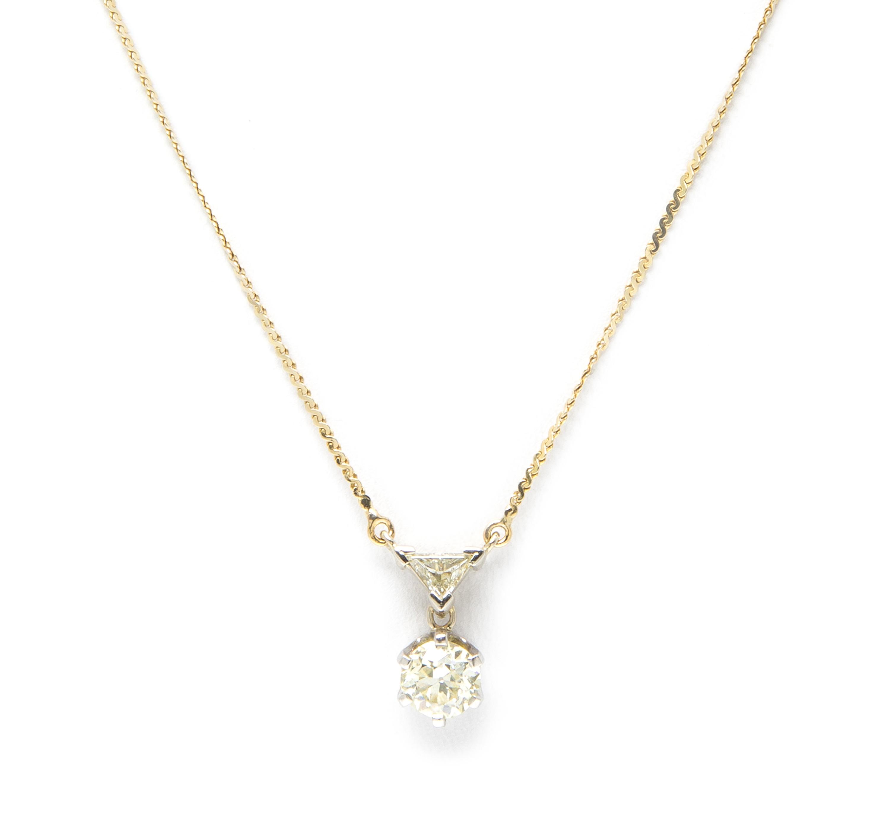 A 14 Karat Yellow and Diamond Pendant, 2.40 dwts.