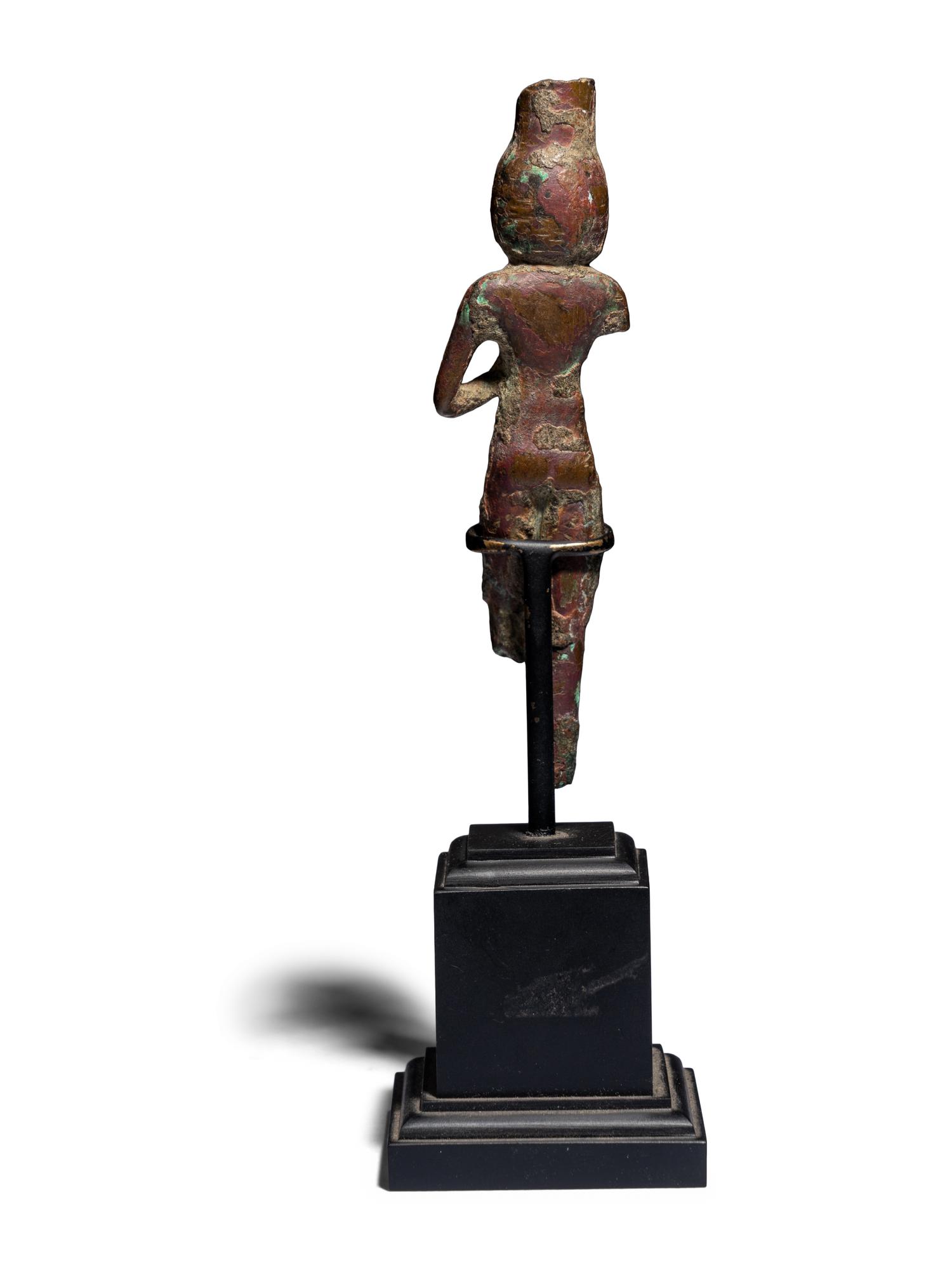An Egyptian Bronze Concubine Holding a Duck