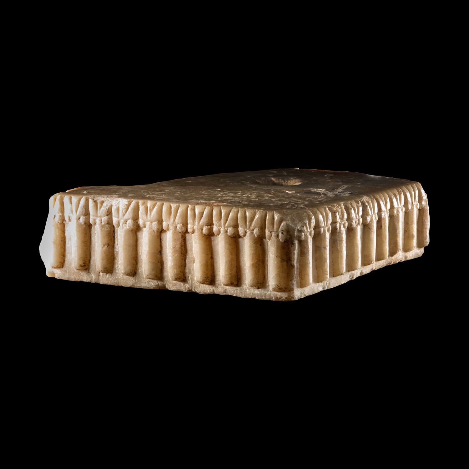 A South Arabian Fragmentary Albaster Ibex Base