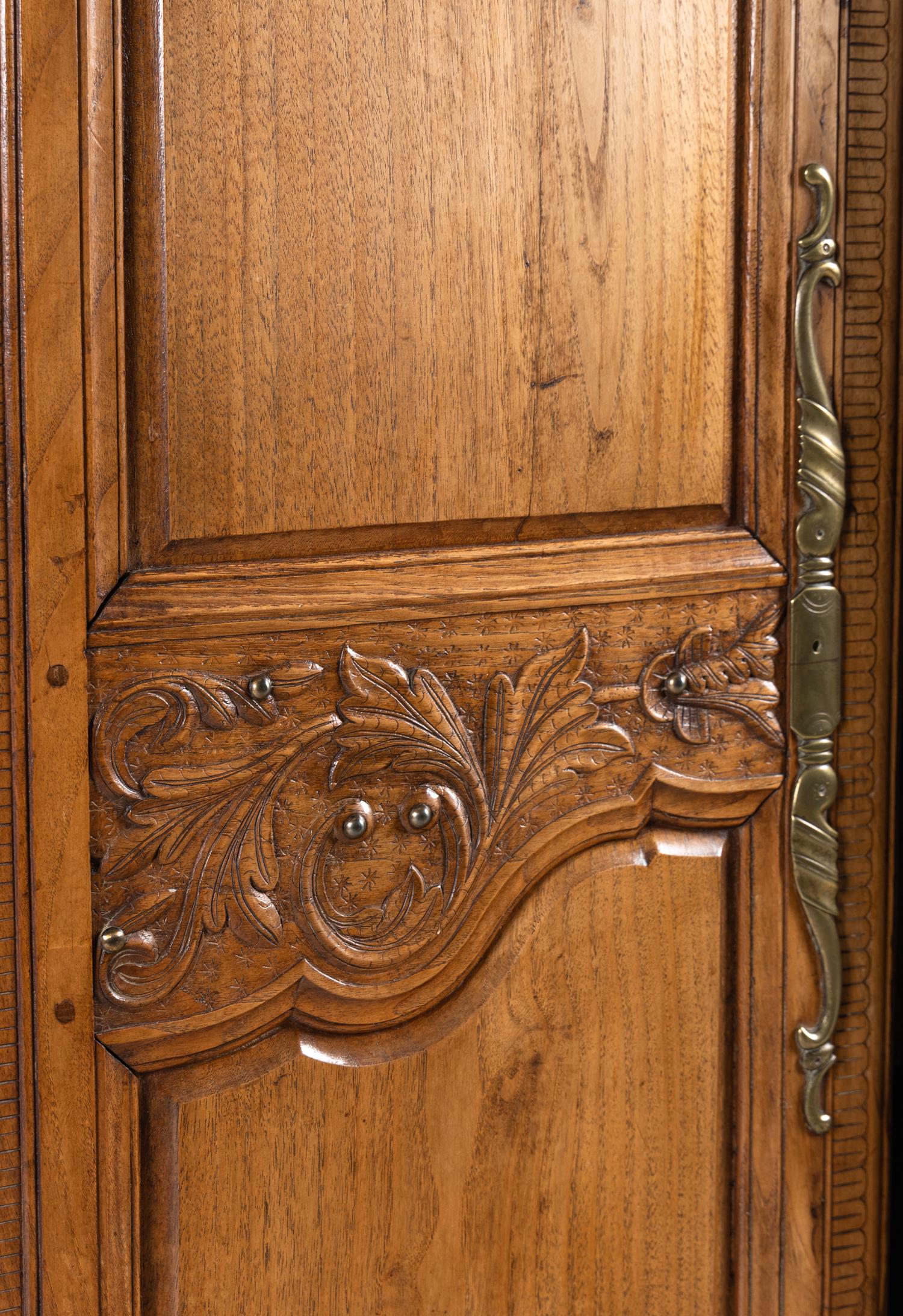 A French Carved Walnut Armoire