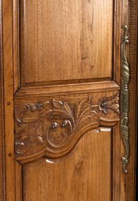 A French Carved Walnut Armoire