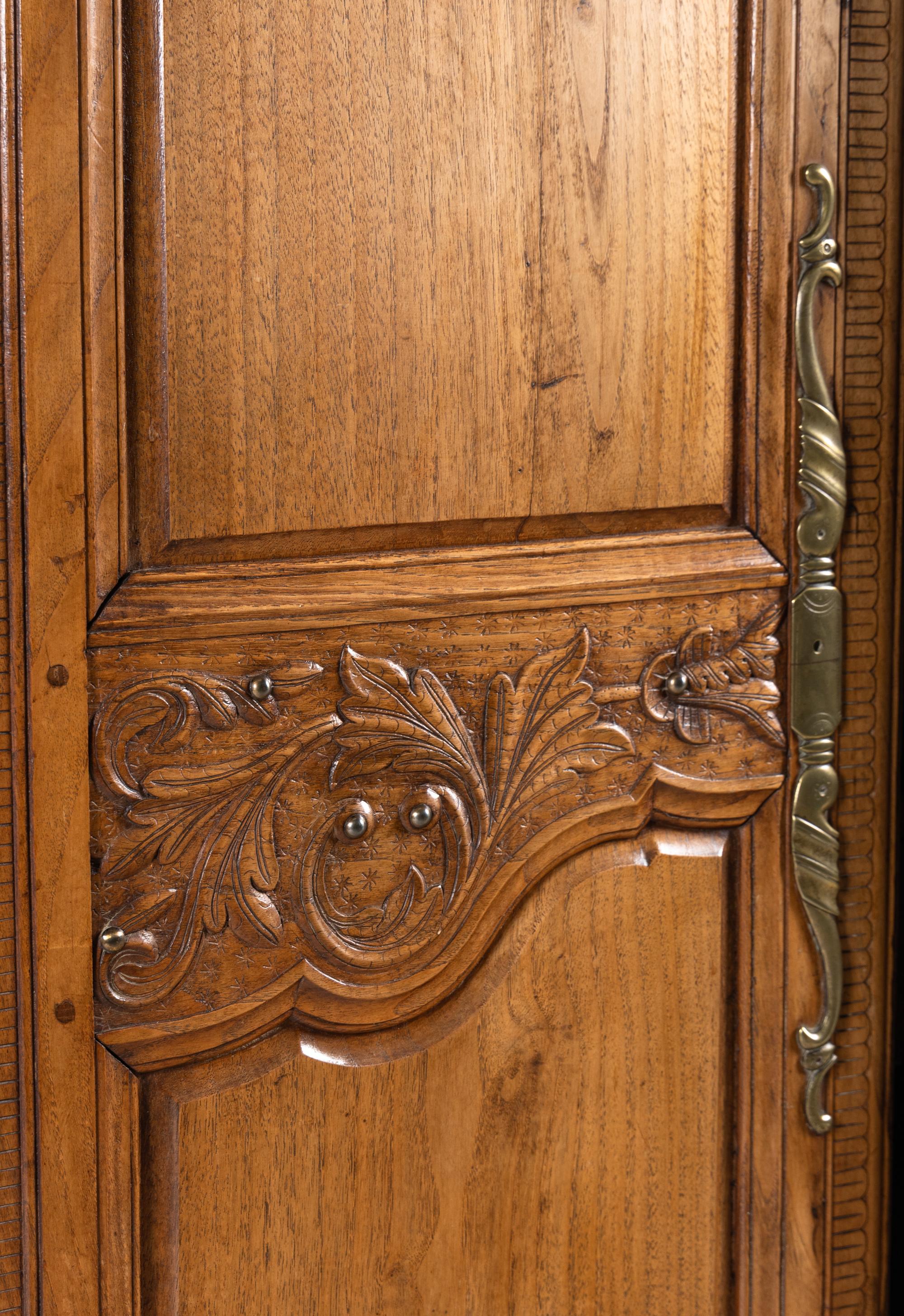 A French Carved Walnut Armoire