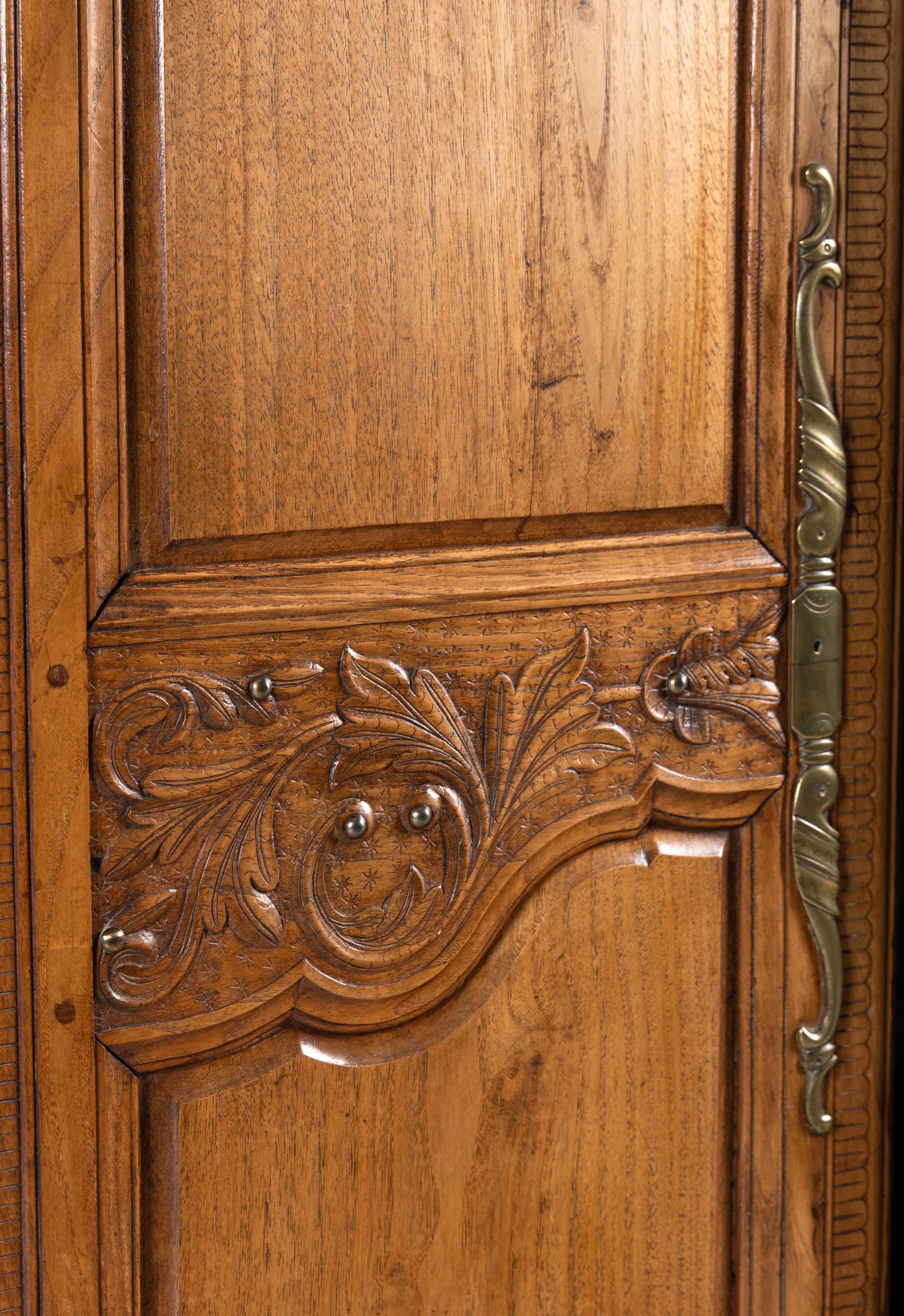 A French Carved Walnut Armoire
