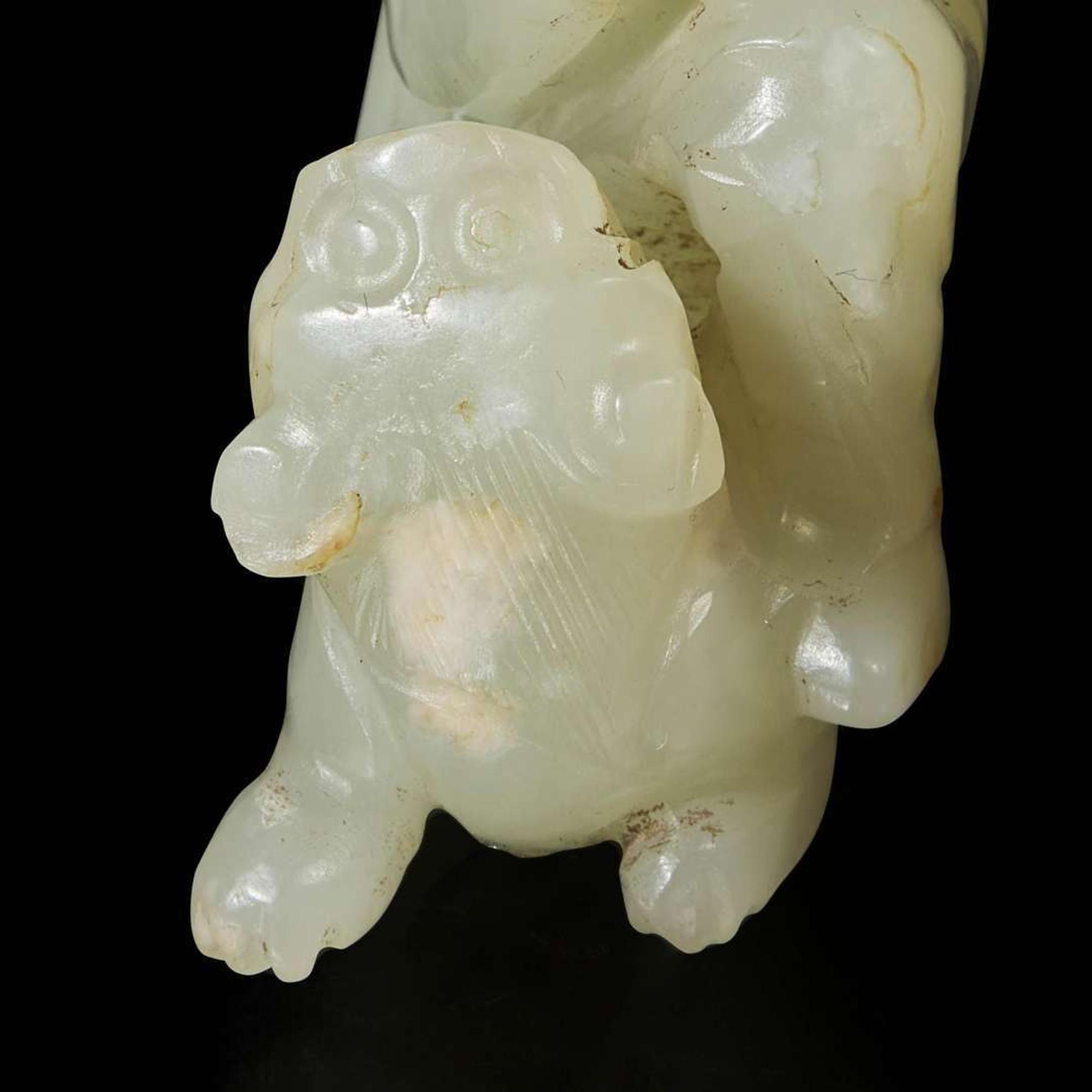 A rare Chinese jade carving of a foreigner and mythical beast 胡人戏兽玉雕 Tang dynasty or later ????