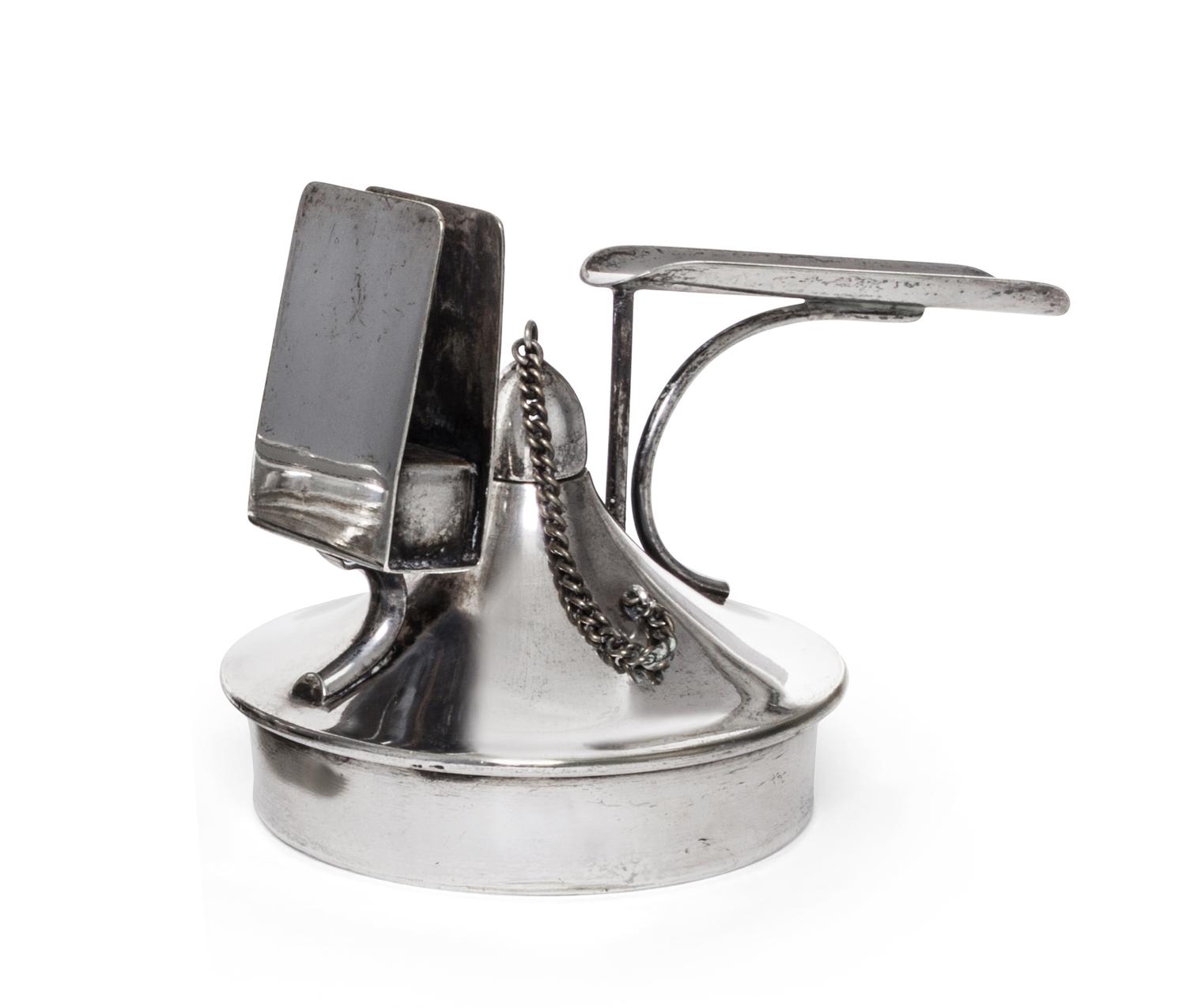An Austrian Silver-Plate Cigar Lighter, 20th Century, of circular handled form with a matchbox holder.