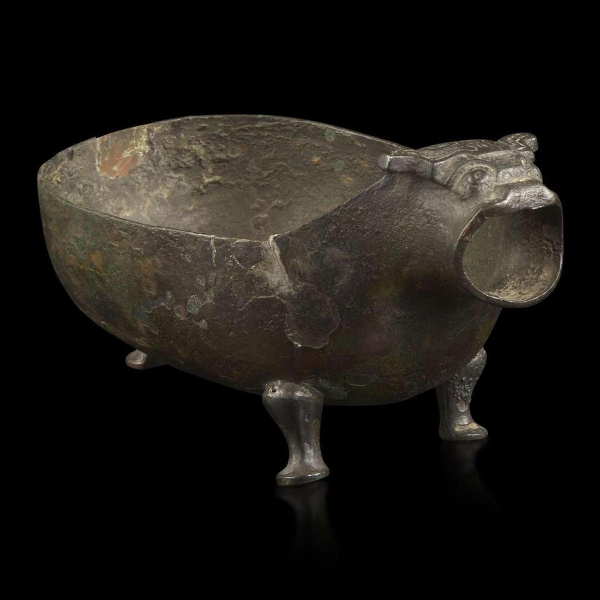 A Chinese archaic bronze animal-form pouring vessel, Yi 青铜兽形匜 Late Eastern Zhou period ????