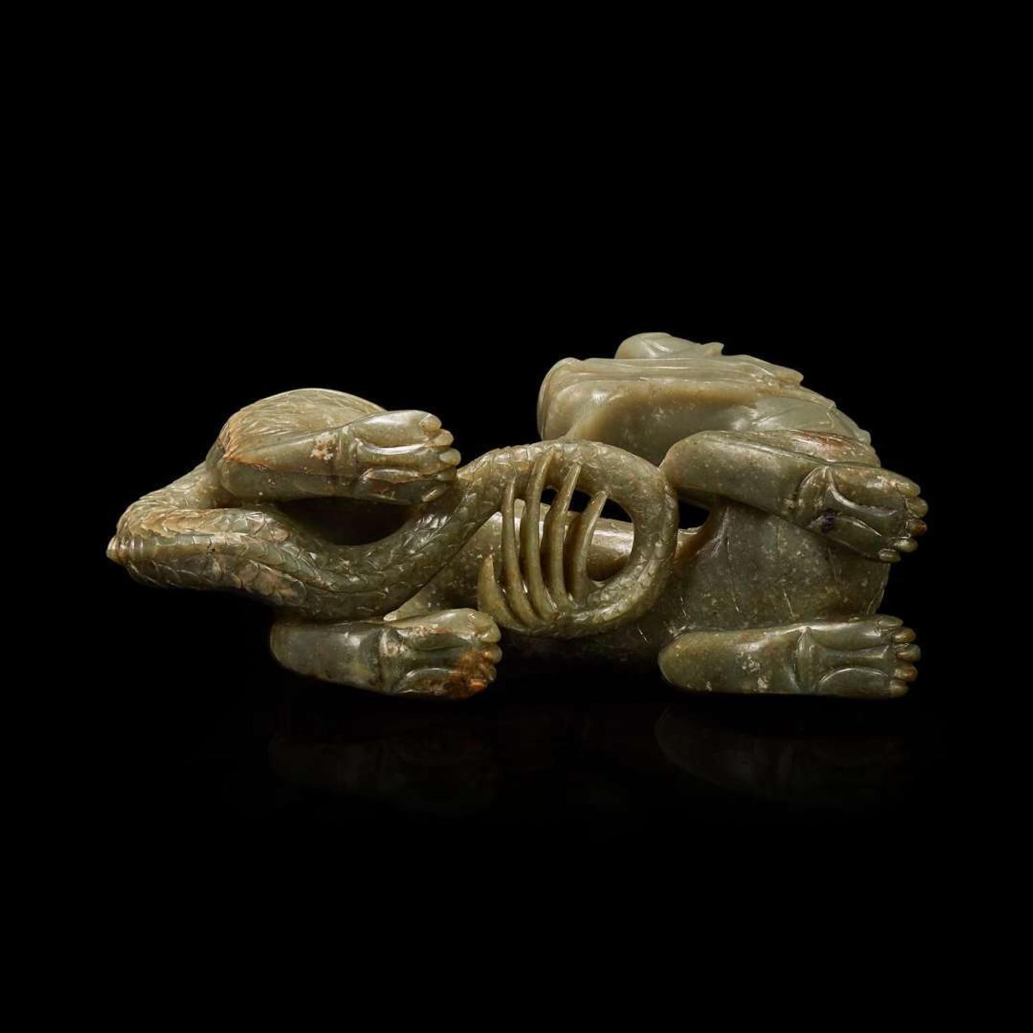 A Chinese carved celadon-grey jade dragon and wood stand 青灰玉龍及木底座