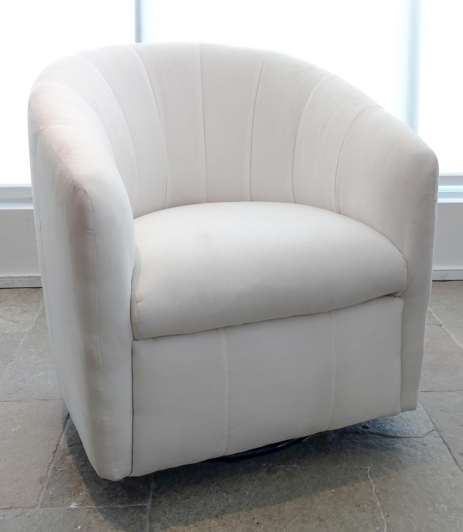 A Contemporary White-Upholstered Swivel Tub Chair Height 32 inches. — 20TH CENTURY