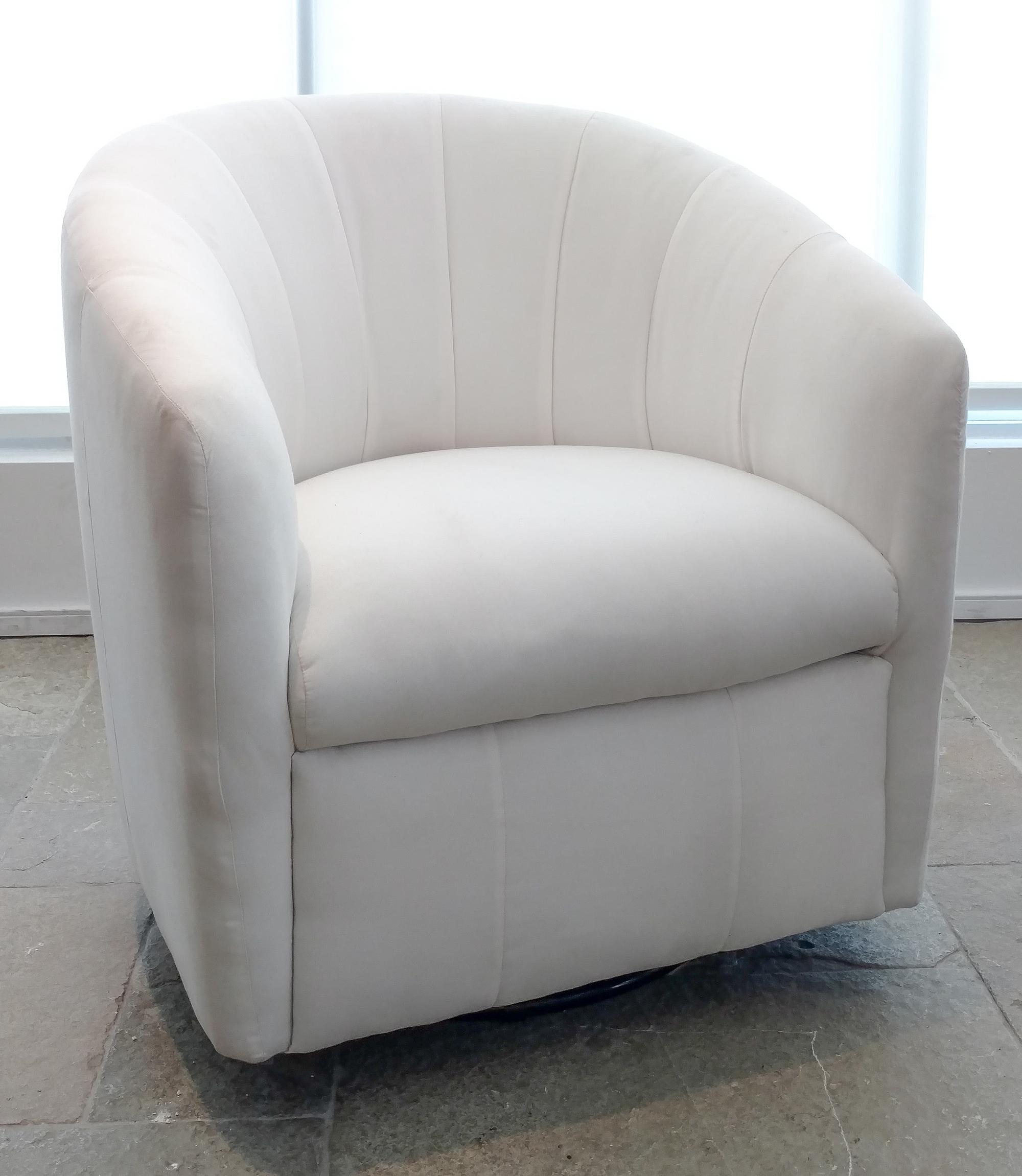 A Contemporary White-Upholstered Swivel Tub Chair Height 32 inches. — 20TH CENTURY