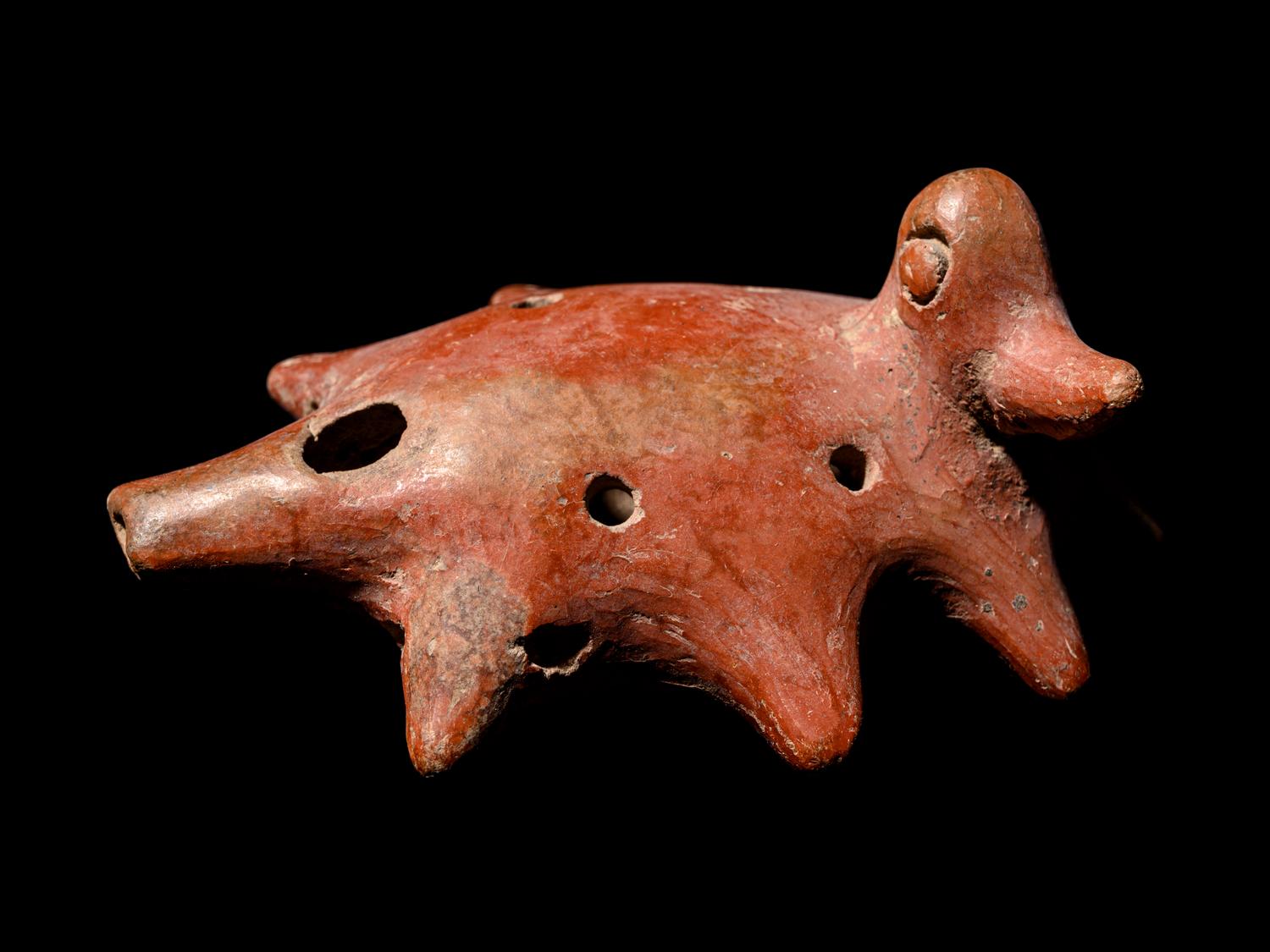 A Group of Four Pre-Columbian Articles: Whistle, Flute, Blade and Necklace