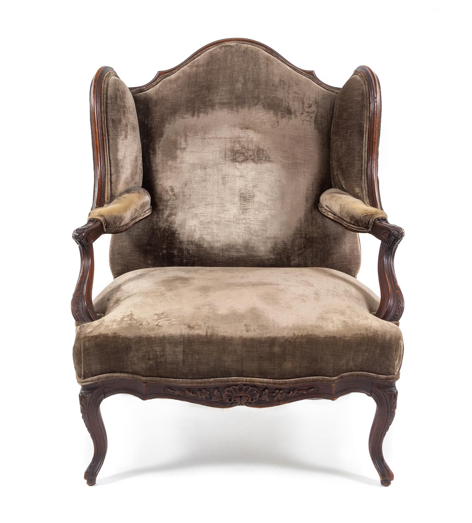 A Louis XV Style Walnut Wingback Fauteuil Height 42 inches. — 19TH CENTURY