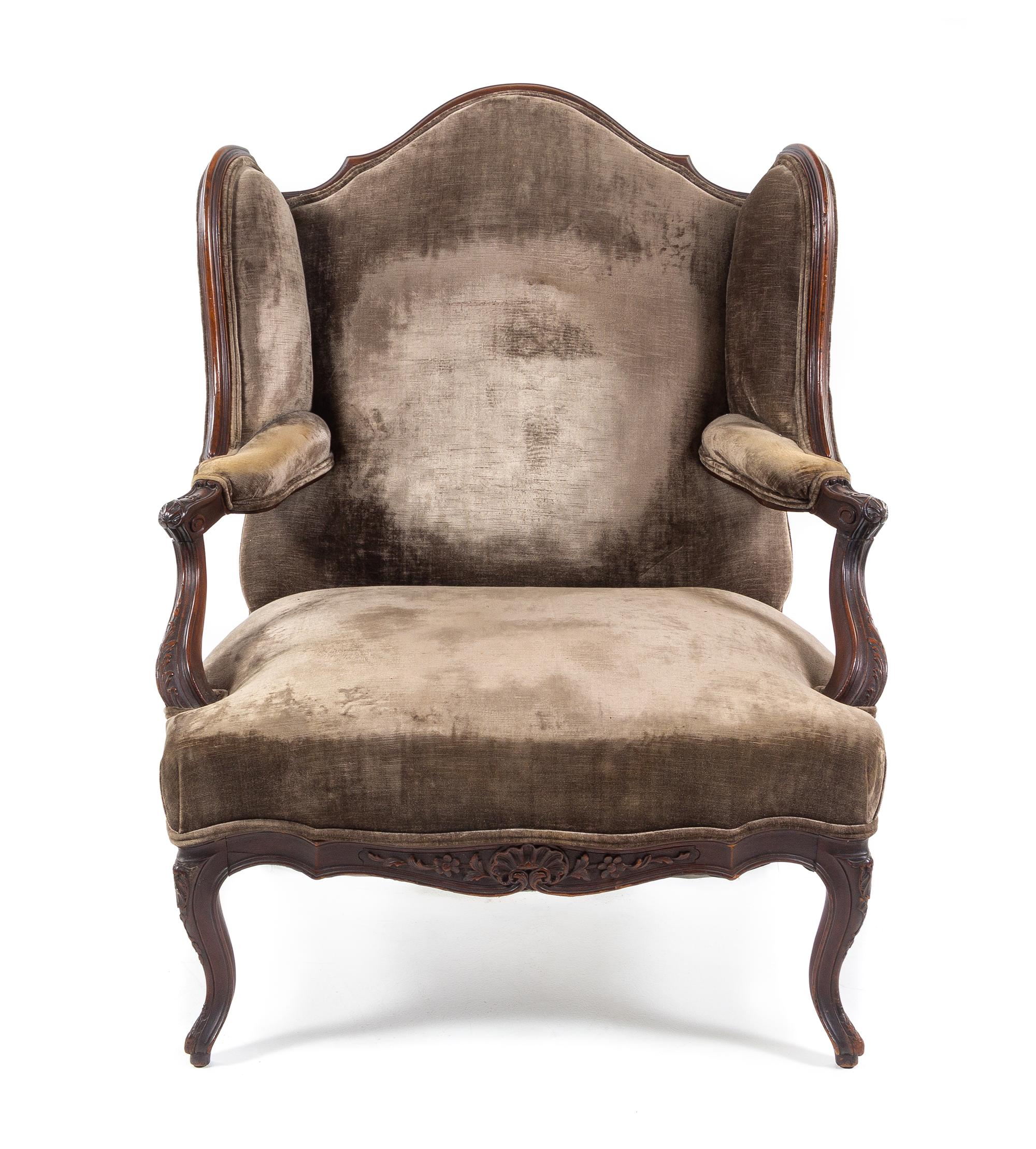 A Louis XV Style Walnut Wingback Fauteuil Height 42 inches. — 19TH CENTURY