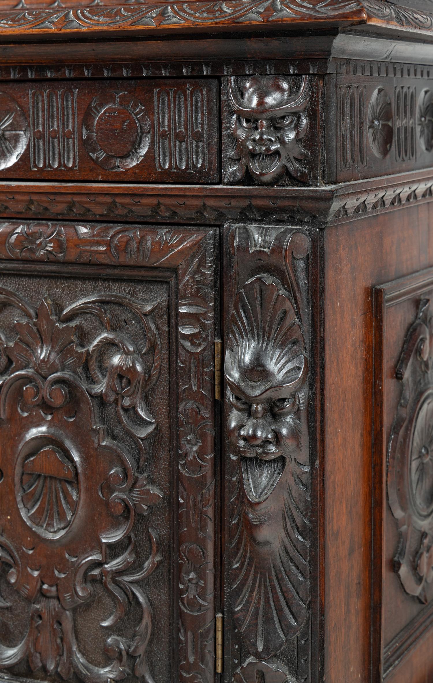 An Austrian Carved Walnut Cabinet