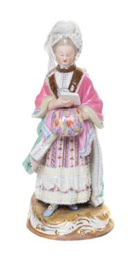 A Meissen Porcelain Lace Figure, Height 8 1/4 inches.