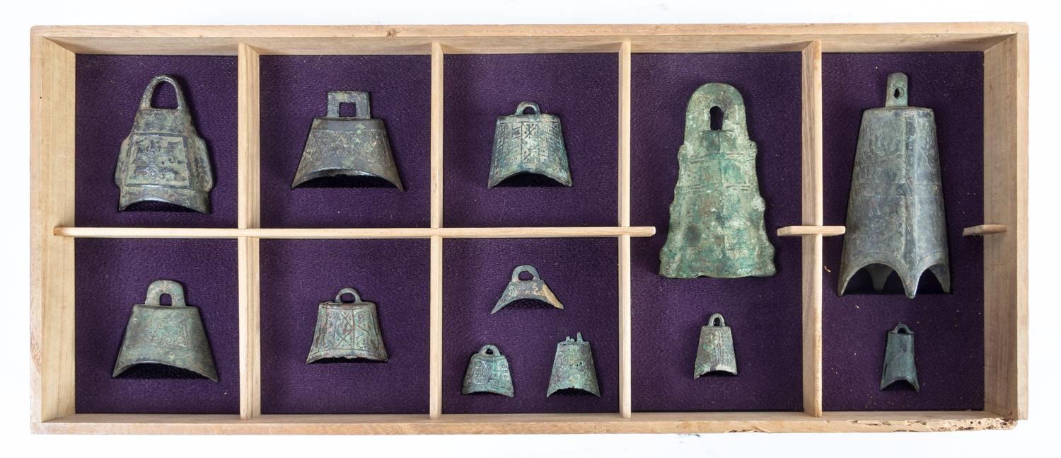 A Set of Twelve Chinese Bronze Bells HAN DYNASTY OR EARLIER Height of tallest 5 1/4 inches. — HAN DYNASTY OR EARLIER