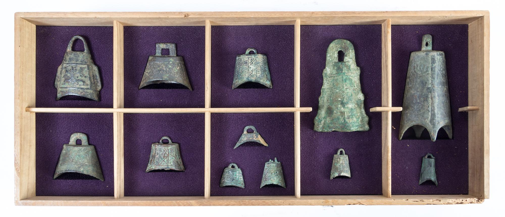 A Set of Twelve Chinese Bronze Bells HAN DYNASTY OR EARLIER Height of tallest 5 1/4 inches. — HAN DYNASTY OR EARLIER